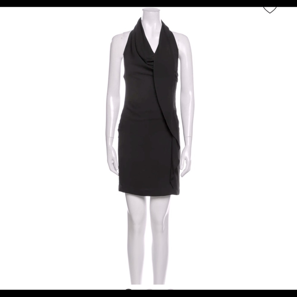 Black halter neck sheath dress with ruffle embellishment, hidden back zipper.